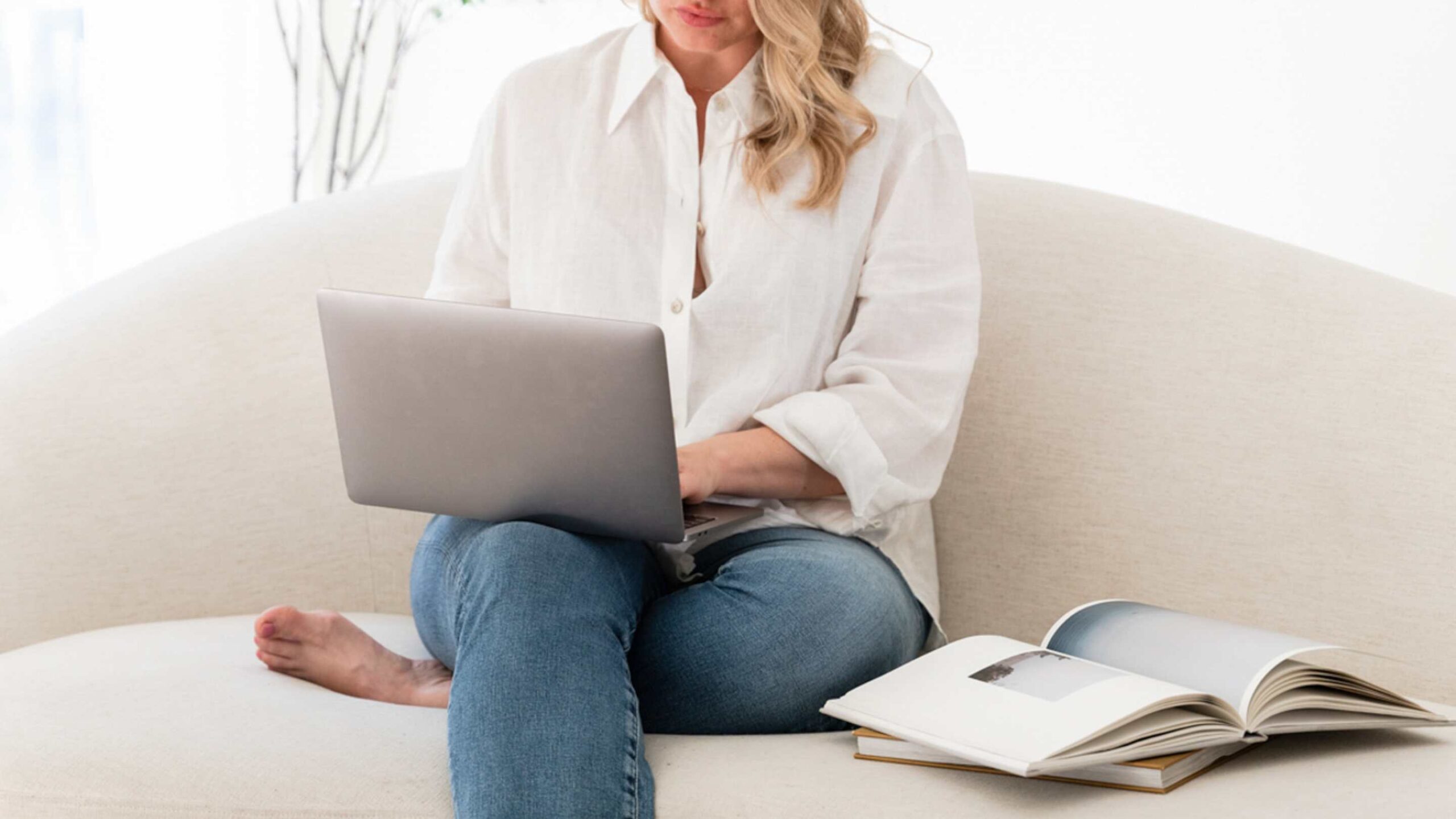 Female course creator working on her laptop building her email list